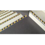A black and yellow striped Warrior Stair Nosing.
