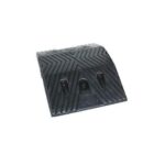 A black rubber mat on a white background, resembling a rubber speed hump.