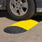 A black and yellow car with speed hump capabilities.