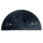 A black plastic cover with two holes on it, resembling a rubber speed hump.
