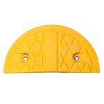 A yellow rubber grate with a hole in the middle.