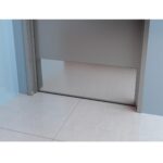 An image of a toilet door with a blue tile floor and a SS 316 kick plate.