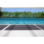 An image of a swimming pool with a Warrior Rubber Hollow Mat 22MM Thk 100CM Width 150CM Length Black.